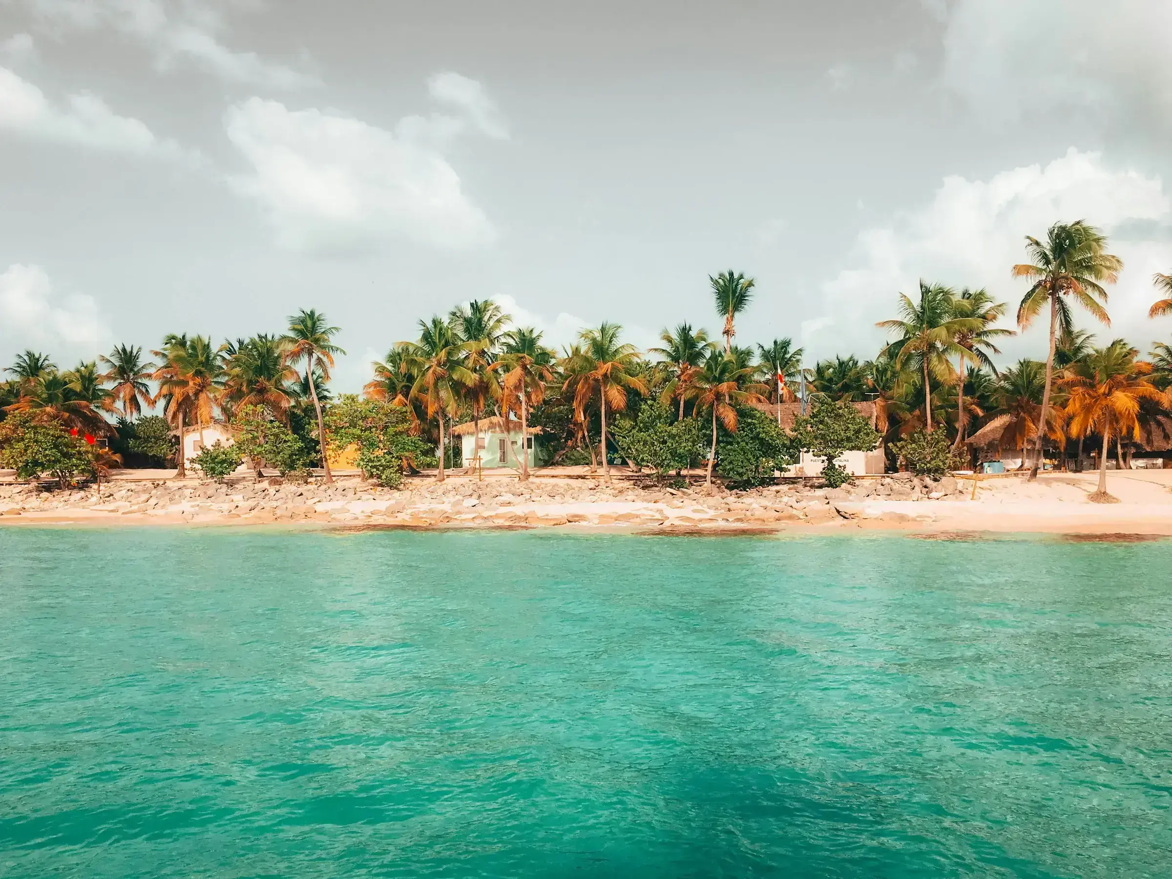 A wide, unhurried Caribbean horizon at the meeting point of sea and sky — visa-free travel is only one of many benefits a second citizenship brings.