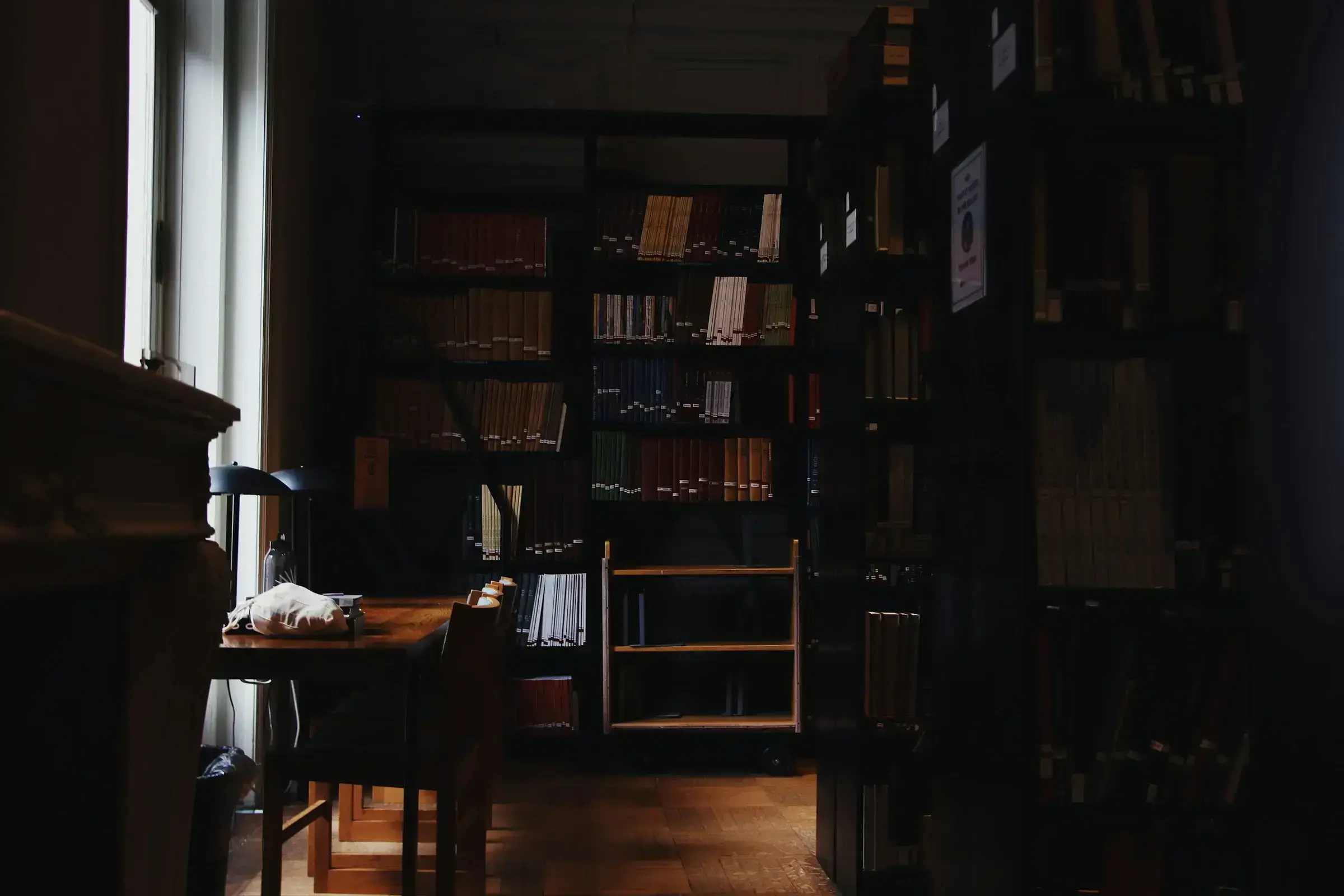 Two chairs facing each other in a discreet office setting — the architecture of a serious advisory conversation.