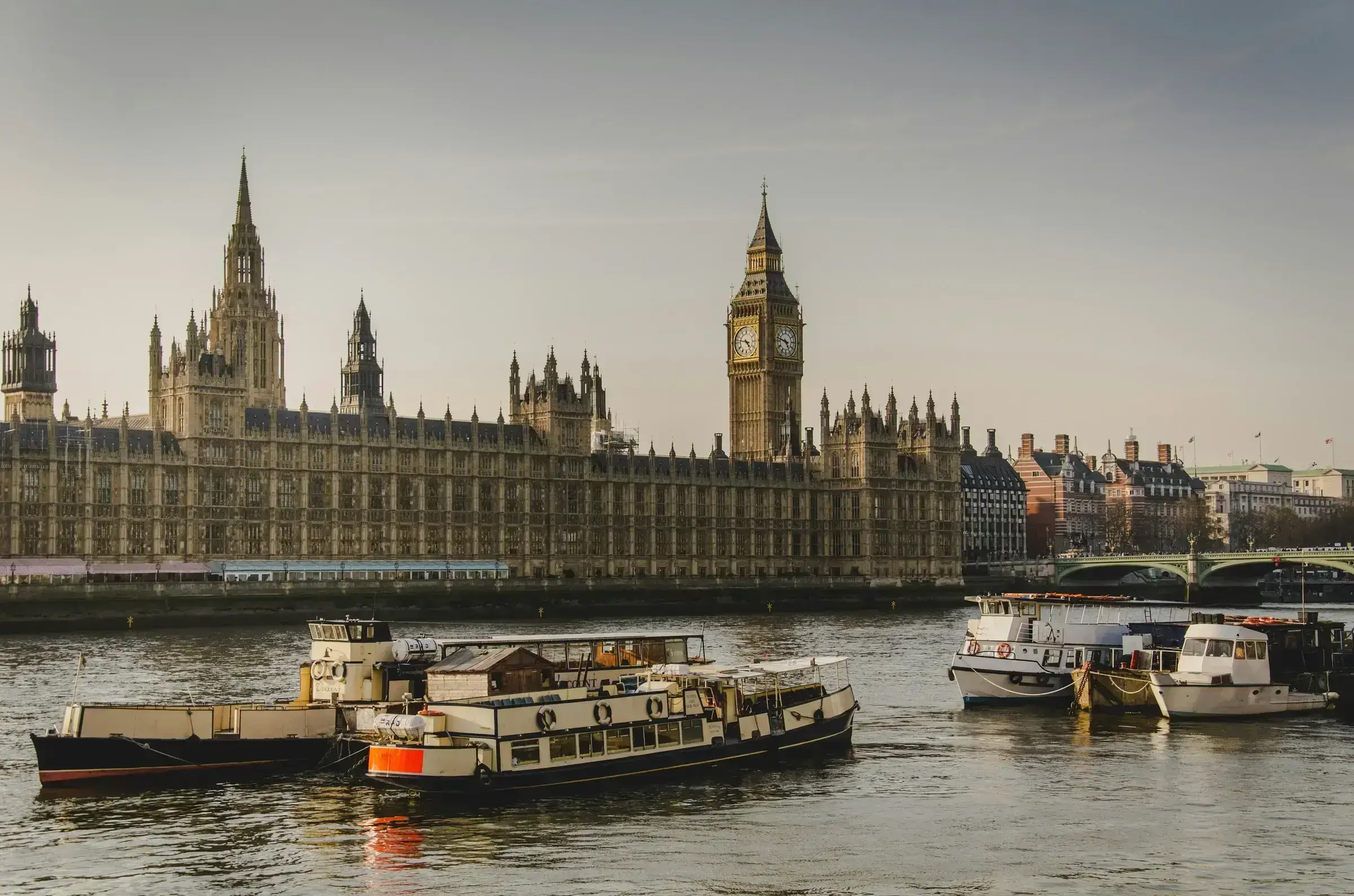 The Houses of Parliament and Big Ben alongside the Thames — an unmistakably British view, framing the UK visa policy environment.