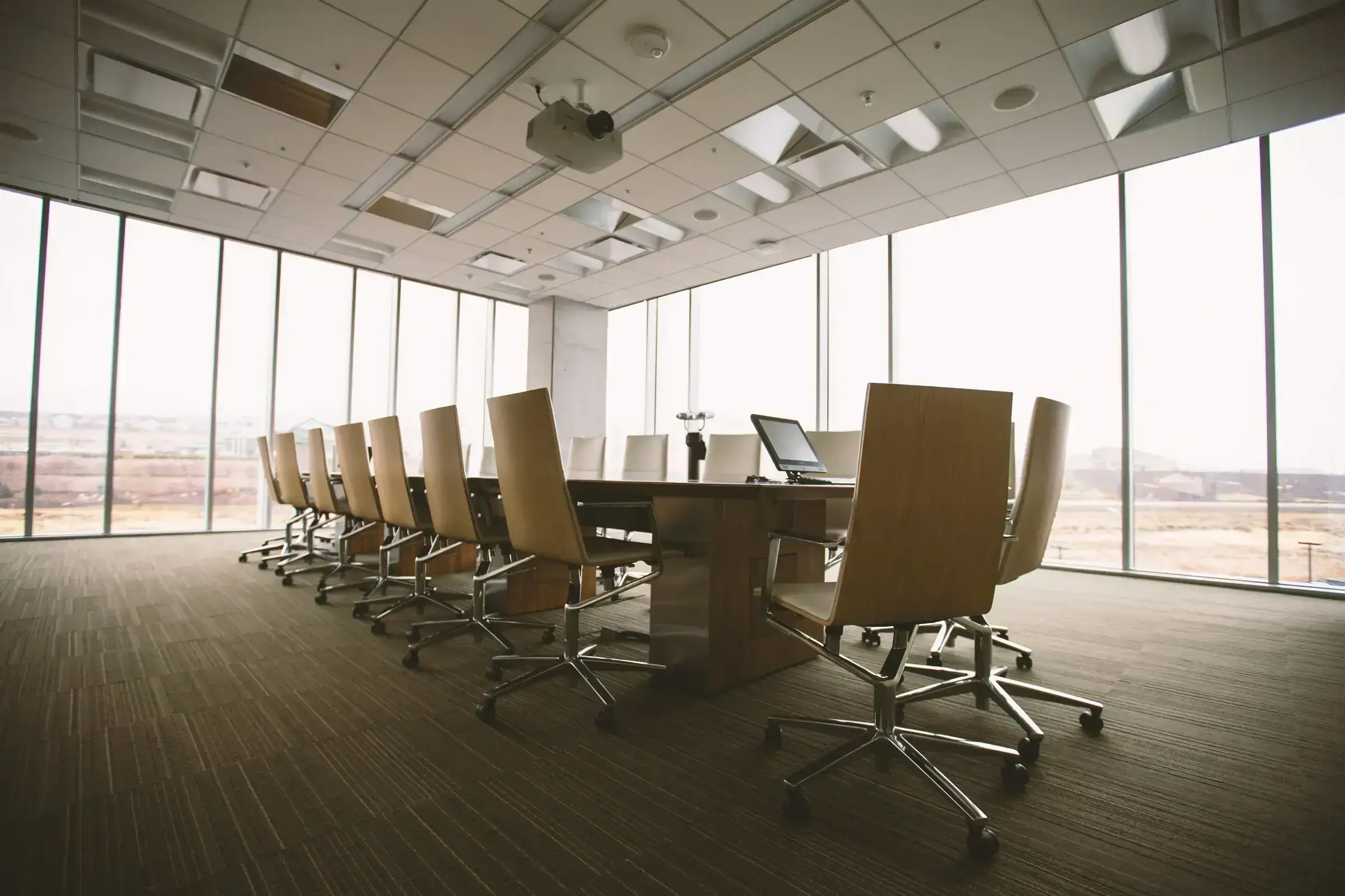 An empty formal conference interior, ready for a working session.