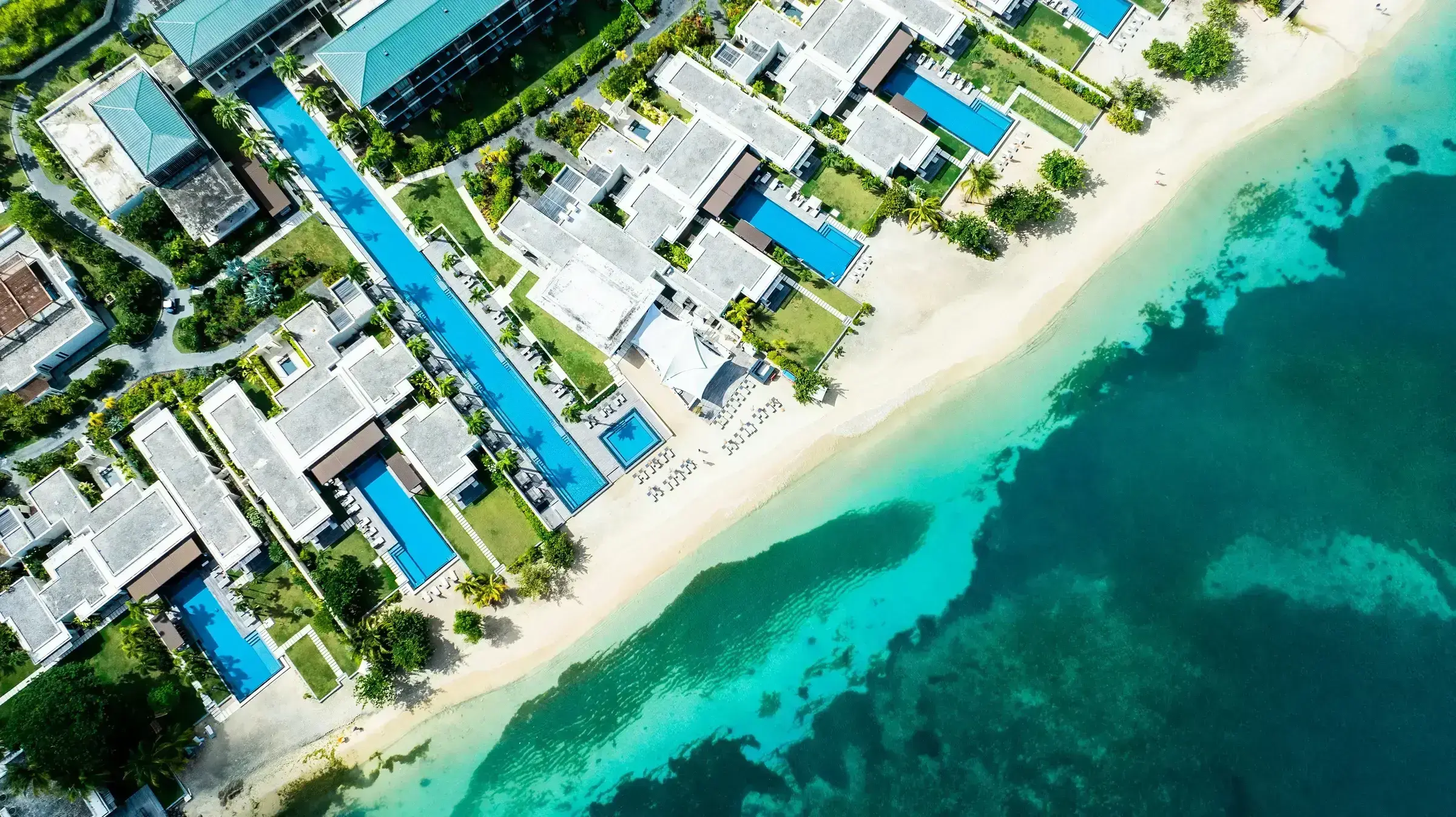 An aerial view of the Silversands Hotel in Grenada, a premier Caribbean real-estate landmark — visual shorthand for the upmarket end of the CBI investment landscape.