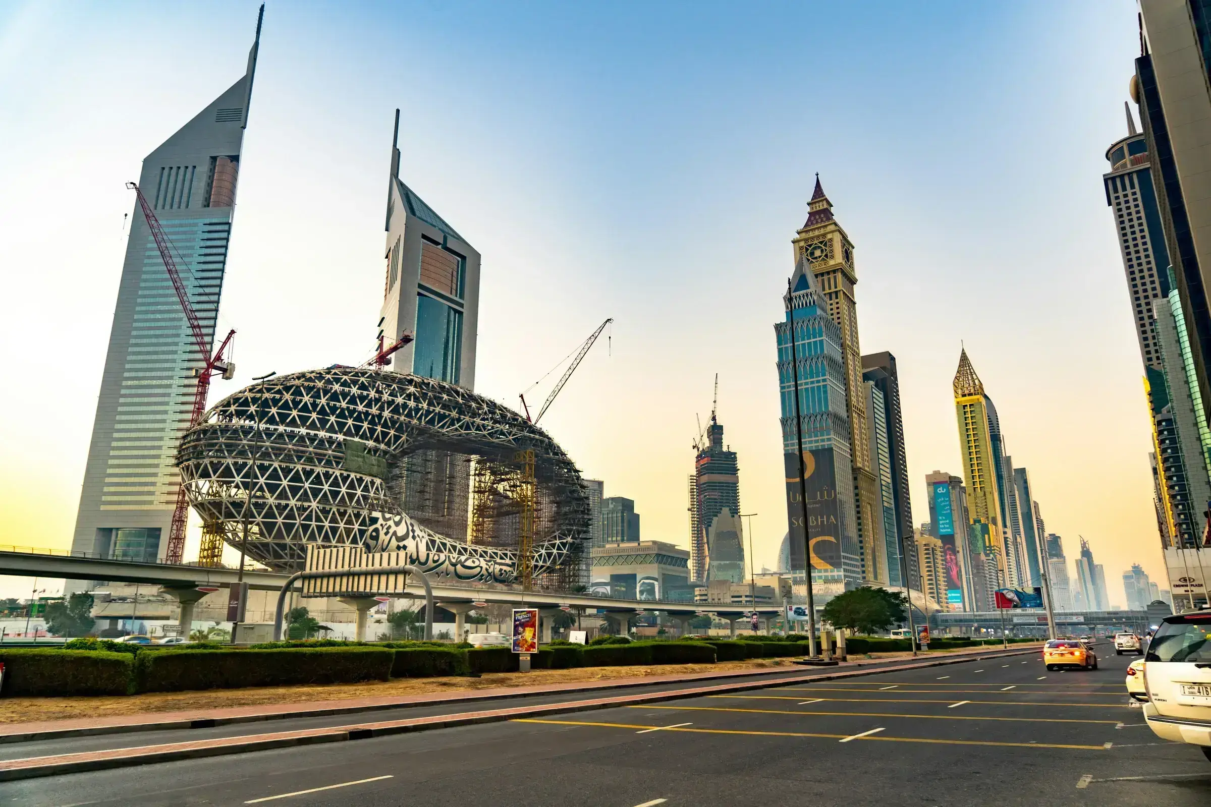 A Gulf skyline at dusk, restrained and measured — the regulated business environment where Middle Eastern principals operate.