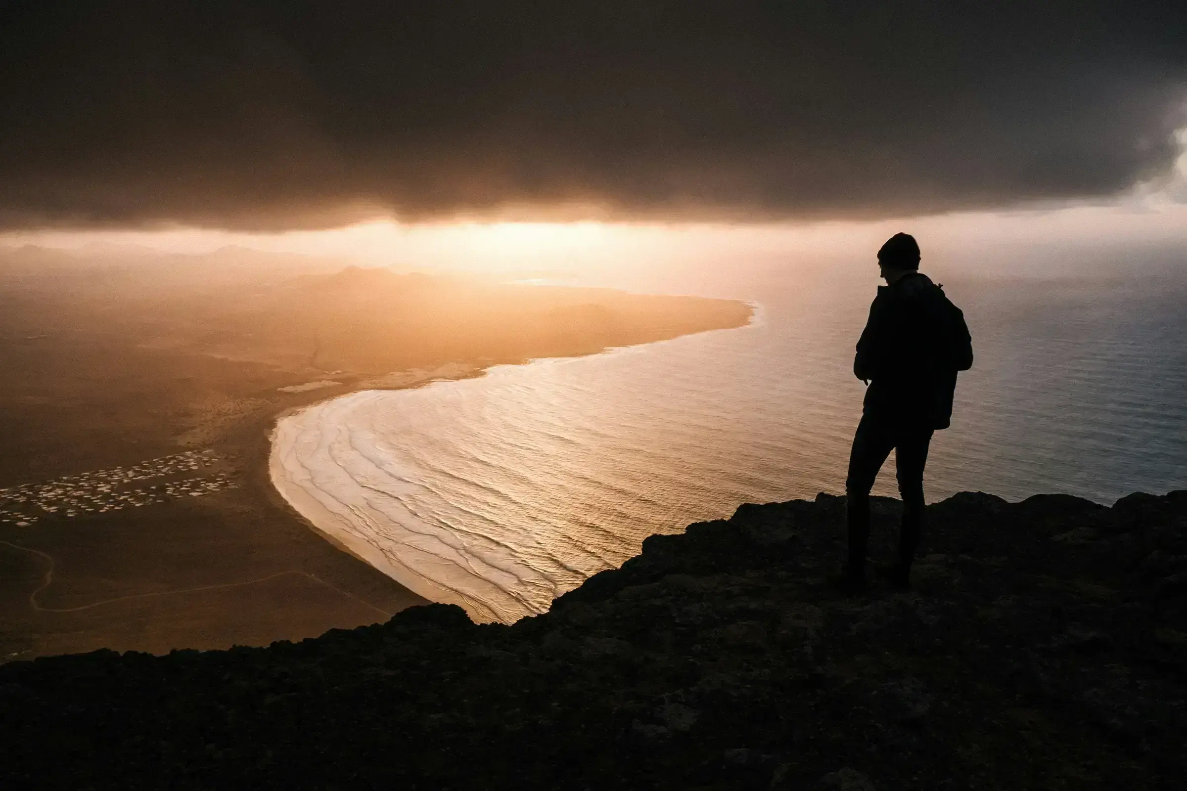 A single, quiet image of a horizon — the visual register of a people who, for generations, have lived without the legal recognition that a passport provides.