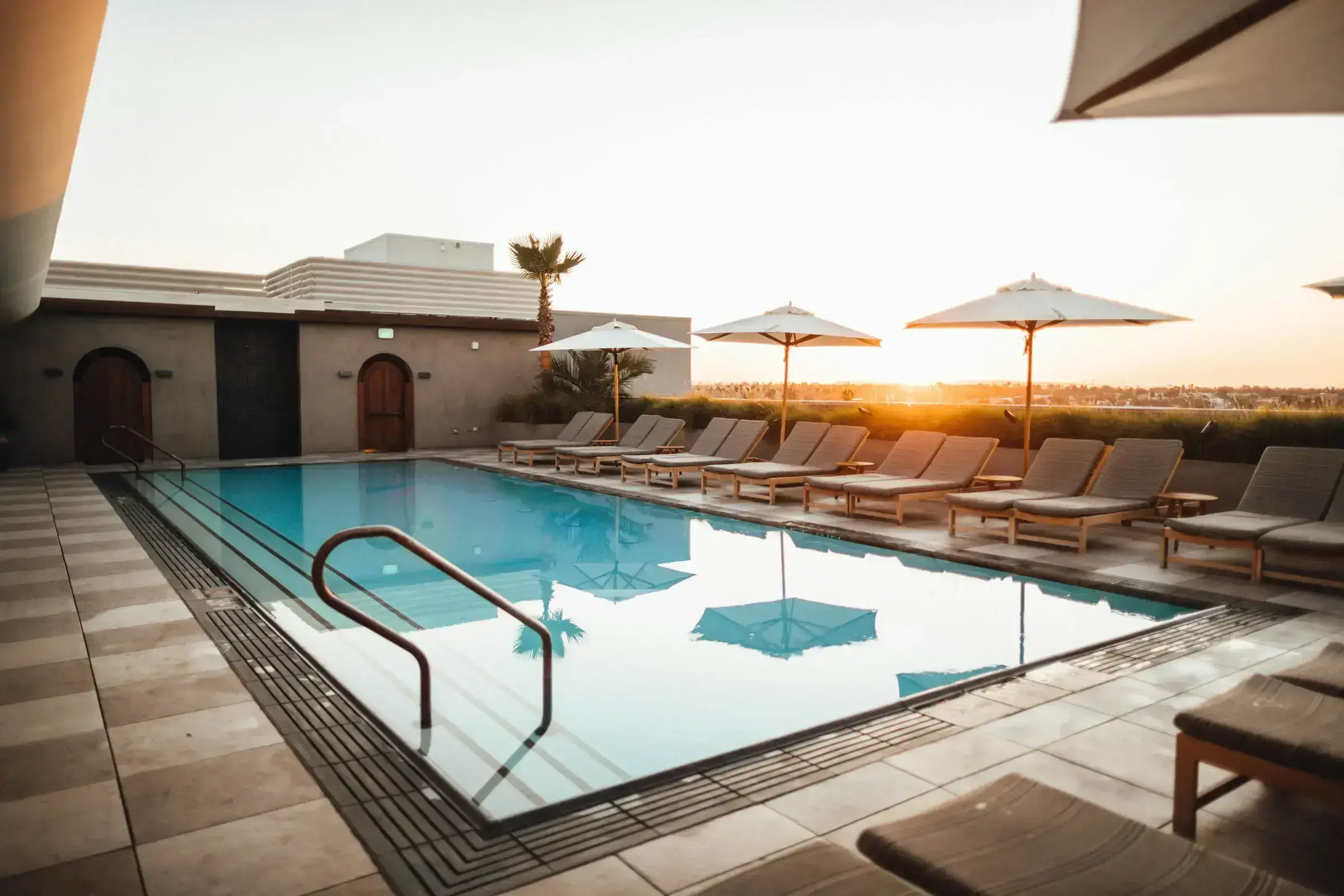 A premium Caribbean property exterior with a terrace open to the sea — the kind of qualifying real estate that anchors the property route.